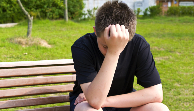 boy leaning on his hands